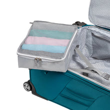 Load image into Gallery viewer, Interior view of the teal suitcase with a packing cube filled with folded clothes.