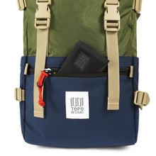 Load image into Gallery viewer, Close up to the front panel's pocket unzipped with a small black wallet peeking from it. (Wallet not included).