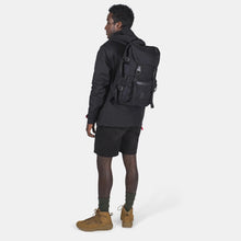 Load image into Gallery viewer, Back Angled View of a young man carrying the backpack.