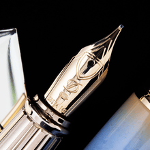 Load image into Gallery viewer, Close up to the fountain pen nib, featuring engraved decorations.
