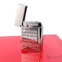 Load image into Gallery viewer, View of the back of the lighter with the cap tilted up.