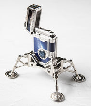 Load image into Gallery viewer, Angled front view of the lighter on the stand, placed on the stand.