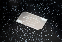 Load image into Gallery viewer, Close up to the engraved medal on the lid of the presentation box.