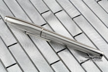 Load image into Gallery viewer, Back view of the fountain pen with the cap on.