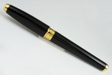 Load image into Gallery viewer, Back view of the fountain pen with the cap on.