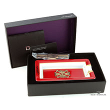 Load image into Gallery viewer, The ashtray arranged in its presentation box with the booklets on a white background.