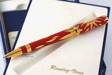 Load image into Gallery viewer, Side view of the ballpoint pen resting on the display box.