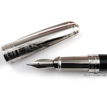 Load image into Gallery viewer, Close up to the nib and grip section with the cap set to the side.