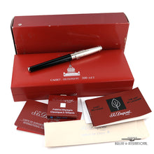 Load image into Gallery viewer, The fountain pen arranged with the packaging and documents. The outer box shows some blemishes.