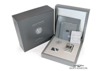 Load image into Gallery viewer, Angled front view of the lighter with the presentation box and packaging.