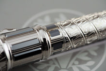 Load image into Gallery viewer, Close up to the patina shown on the pen barrel.