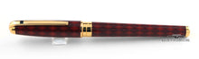 Load image into Gallery viewer, Side view of the rollerball pen with the cap on.