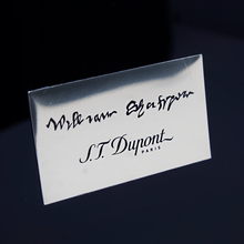 Load image into Gallery viewer, Close up to the medal with the printed Shakespeare signature and S.T. Dupont logo.
