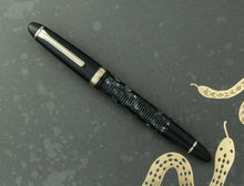 Load image into Gallery viewer, Front view of the fountain pen with the cap on.