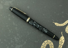Load image into Gallery viewer, Side view of the fountain pen with the cap on.