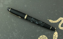 Load image into Gallery viewer, Side view of the fountain pen with the cap on.