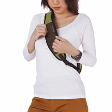 Load image into Gallery viewer, A young woman carrying the cactus colored bag.