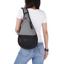 Load image into Gallery viewer, A young woman carrying the stone colored bag.
