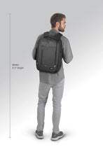 Load image into Gallery viewer, A 6 foot, 3 inches tall model carrying the Backpack.