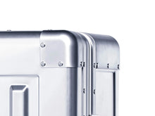 Load image into Gallery viewer, Close up to the corner of a suitcase.