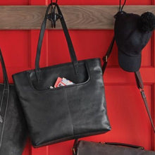 Load image into Gallery viewer, Swerv Leather Collection Business Tote - Black
Image of Business Tote on coat rack.  Showing the U-Shaped open front pocket, ideal for quick access to letters, or documents.
Dimensions:  17 x 14 x 4"