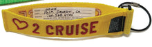 Load image into Gallery viewer, Yellow tag with red text showing a heart icon: Love 2 cruise