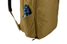 Load image into Gallery viewer, Close up to the backpack in nutria brown. A water bottle is tucked into the compartment.