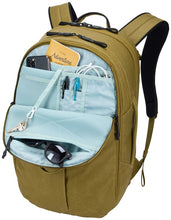Load image into Gallery viewer, Interior view of the front pocket filled with accessories in the compartments.