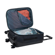 Load image into Gallery viewer, Interior view of the suitcase with folded clothes arranged within the compartments.