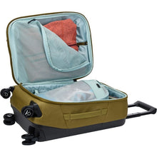 Load image into Gallery viewer, The Nutria Brown suitcase laid on its back with the main compartment opened and filled with clothes.