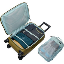 Load image into Gallery viewer, Interior view of the suitcase with a packing bag next to it.