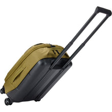 Load image into Gallery viewer, Angled back panel view of the suitcase leaning back with the telescopic handle partly extended.