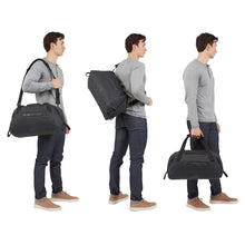 Load image into Gallery viewer, Three views with the options to carry the black duffle bag: Via shoulder strap, as a cross sling bag, and by the grab handles.
