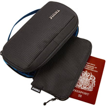 Load image into Gallery viewer, The travel organizer arranged with the detachable RFID bag and a red passport.