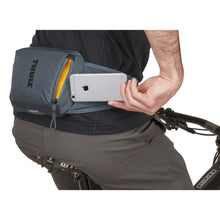 Load image into Gallery viewer, Close up of the pack as a man pulls a cellphone from the pocket.