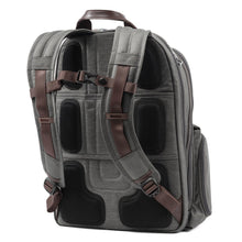 Load image into Gallery viewer, Angled back panel view of the gray backpack showing the padded back and adjustable shoulder straps.