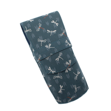 Load image into Gallery viewer, Front view of the Dragonfly Forest pen roll. It is a warm green with patterns of white and red dragonflies.