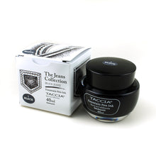 Load image into Gallery viewer, The black ink bottle with its box on a white background. It is a charcoal black color.