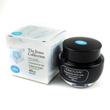 Load image into Gallery viewer, The grey ink bottle with its box on a white background. It is a light sky blue .