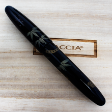 Load image into Gallery viewer, Side view of the fountain pen with the cap on. Placed on top of the wooden presentation box lid.