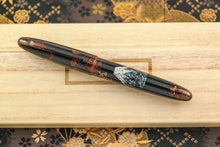 Load image into Gallery viewer, Front view of the pen with the cap on.