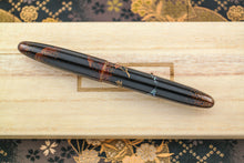Load image into Gallery viewer, Back view of the fountain pen with the cap on.