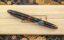 Load image into Gallery viewer, Side view of the fountain pen with the cap on.