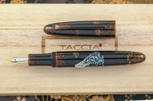 Load image into Gallery viewer, Front view of the fountain pen with the cap set to the side.