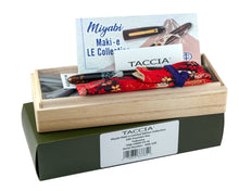 Load image into Gallery viewer, The fountain pen arranged with the card stock box, presentation box, pen, pen sleeve, documents, and ink cartridges on a white background.