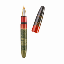 Load image into Gallery viewer, The fountain pen with the cap set to the side on a white background.