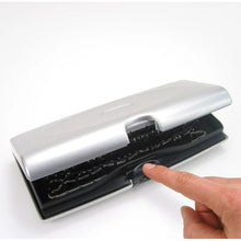 Load image into Gallery viewer, Angled front view of the silver case with a hand opening it.