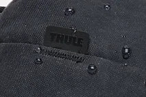 Load image into Gallery viewer, Close up to the Thule logo tag on the side of the front panel.