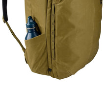Load image into Gallery viewer, Close up to the side panel of the backpack with a water bottle tucked into the pocket. (Bottle not included).