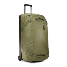 Load image into Gallery viewer, Angled front panel view of the olivine green wheeled duffle.